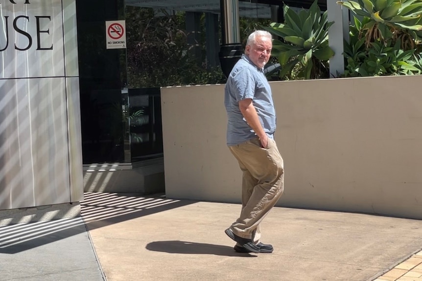 man walking outside court