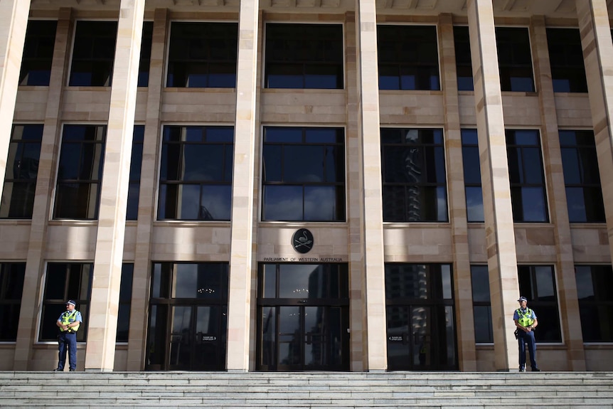 A wide shot of the WA Parliament House with two of the security officers standing at the far sides of the photo.