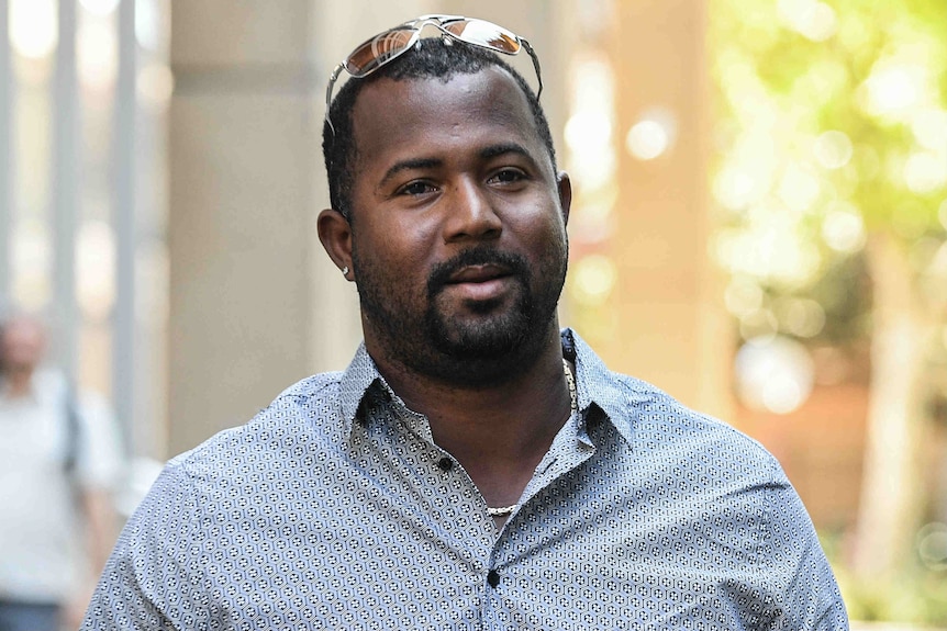 Man walking into court.