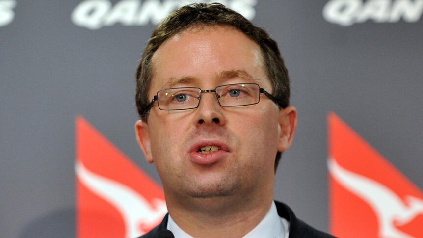 Qantas CEO Alan Joyce speaks to the media
