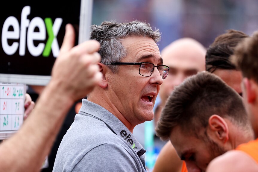 Coach of the GWS Giants Leon Cameron looks exasperated as he addresses his players