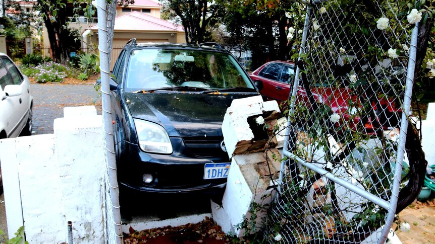 fence damaged by car