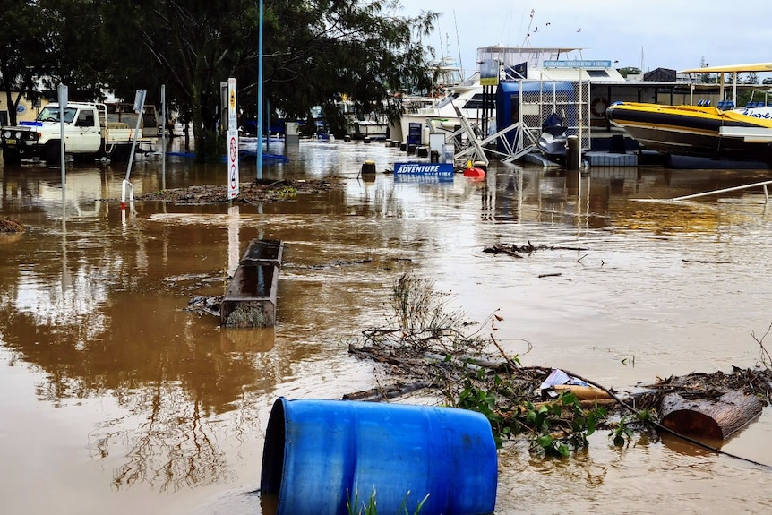 Debris and puddles where a road should be