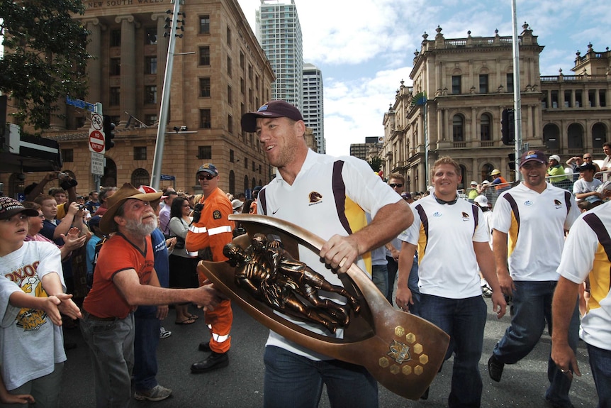 NRL hero ... Brad Thorn with the premiership trophy during his Broncos days in 2006