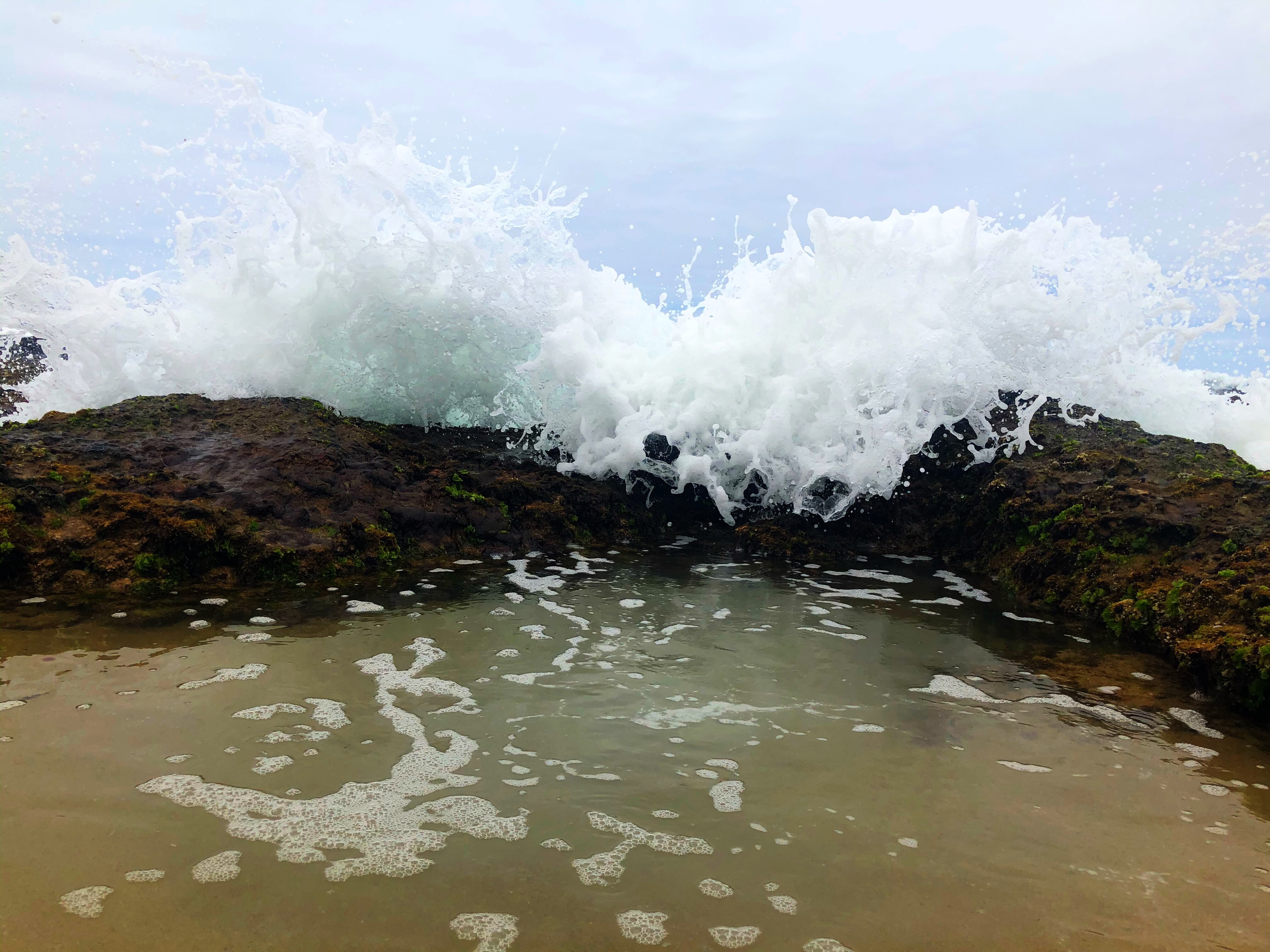 wave crashing over a rock