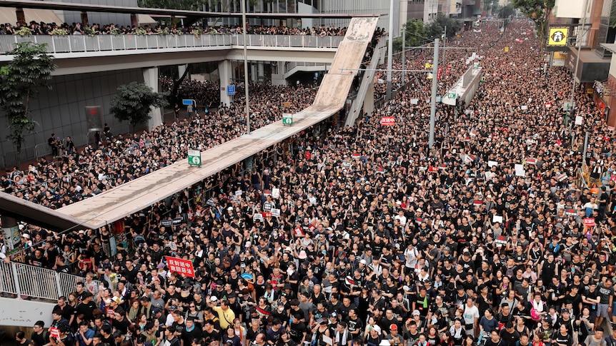 An overhead shot of a sea of people on a street protesting Hong Kong's extradition bill in 2019.