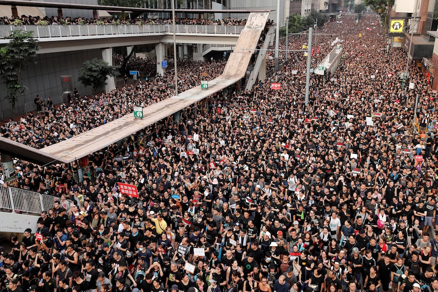 An overhead shot of a sea of people on a street protesting Hong Kong's extradition bill in 2019.