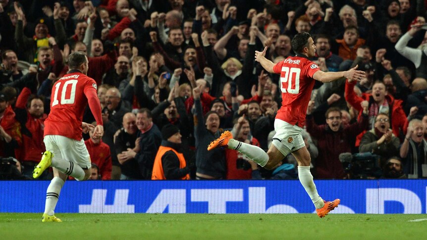 Manchester United striker Robin van Persie (R) celebrates his hat-trick against Olympiakos.