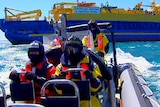 An Australian Customs team leave the Customs ship Oceanic Viking
