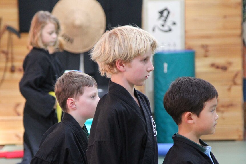 Eight-year-old Finton stands at attention during a ninja class at Bujinkan Tasmania Budo Dojo in Hobart, Tasmania, March 6, 2019