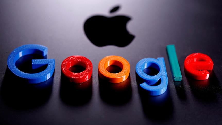 A 3D-printed Google logo sits on an Apple Macbook laptop