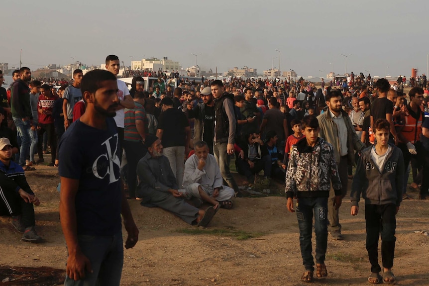 Protesters gather near the fence of Gaza Strip border with Israel during a protest east of Gaza City.