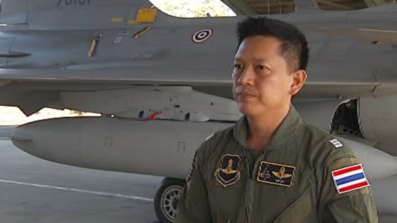 Pilot Nattavut Duangsungnaen stands with one of the Royal Thai Air Force's new JAS-39 Gripen fighter jet