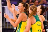 Australian Diamonds Cara Koenen and Steph Wood smile and laugh during a Quad Series netball match against New Zealand.