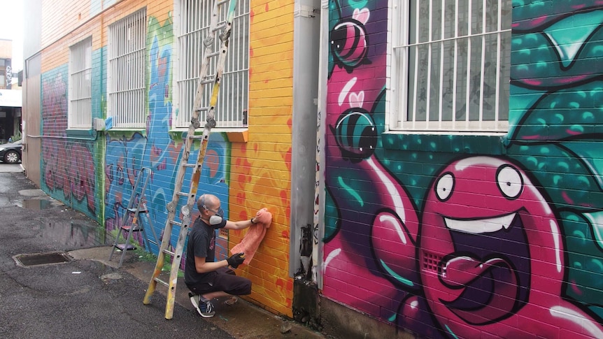 Street artist Shaun Campbell at work