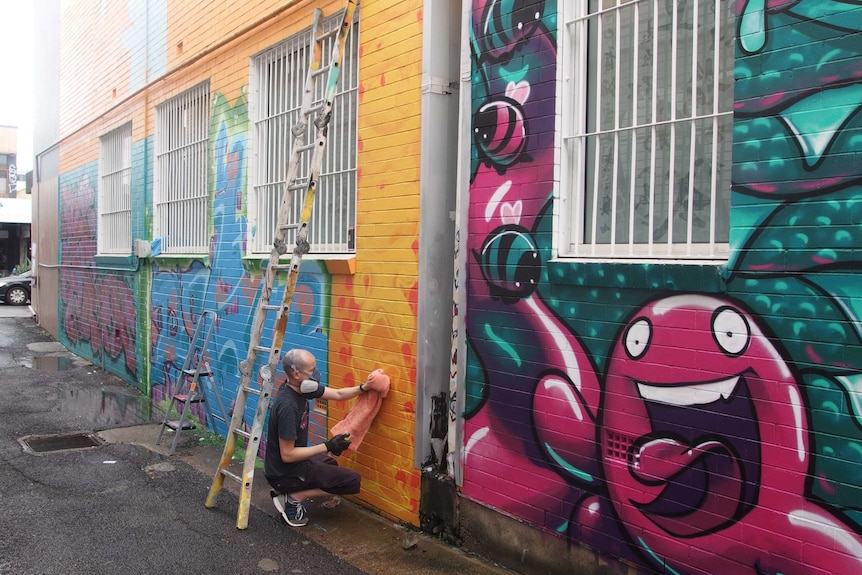 Street artist Shaun Campbell at work