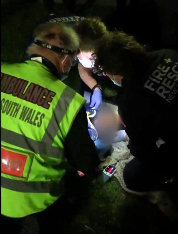 A teenager is treated by emergency services