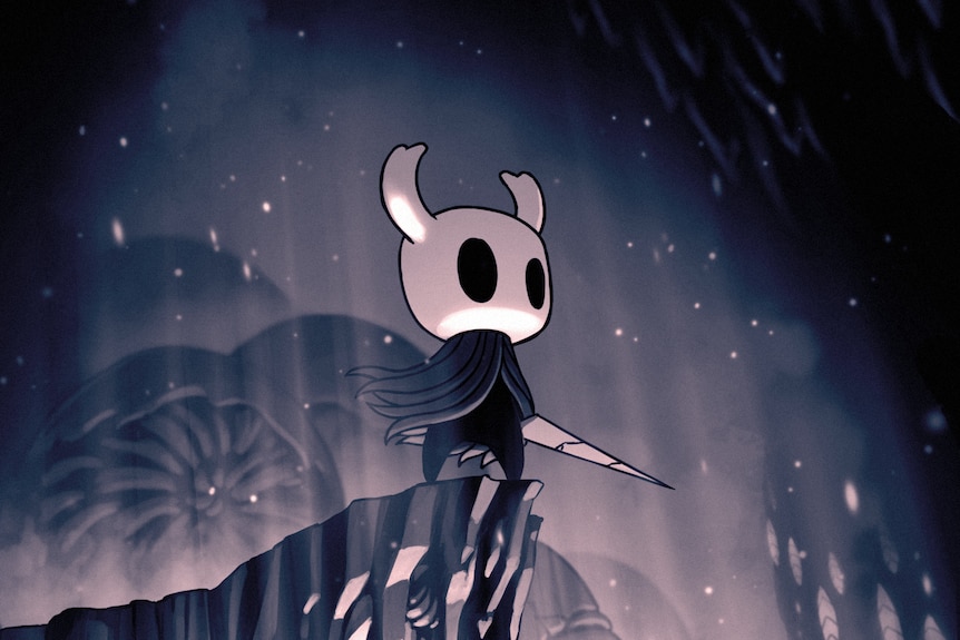 A small demon-like creature, the Knight, stands in a flowing blue cloak with a nail-like sword