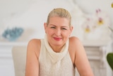 Smiling photo of Brisbane woman Jacqueline Goodwin in her house.