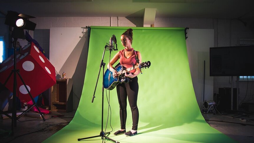 A Colaiste Lurgan student sings in Irish for a music production