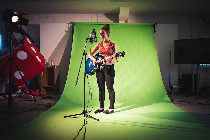 A Colaiste Lurgan student sings in Irish for a music production