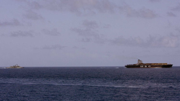 HMAS Sydney approaches merchant ship MSC Stellar off the Yemeni coast.
