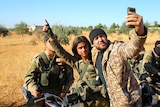 Rebel fighters take a selfie