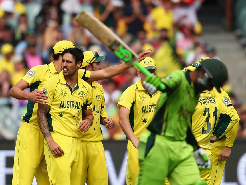 Mitchell Johnson of Australia celebrates after taking the wicket of Haris Sohail