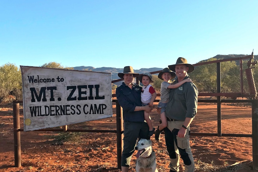 Family standing in front of sign at Mt Zeil Wilderness Park