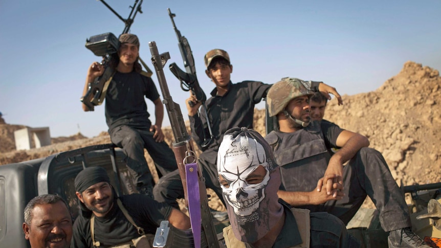 Iraqi militia fighters from Shiite cleric Moqtada al-Sadr's Peace Brigade