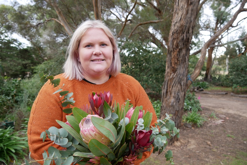 A woman holding flowers