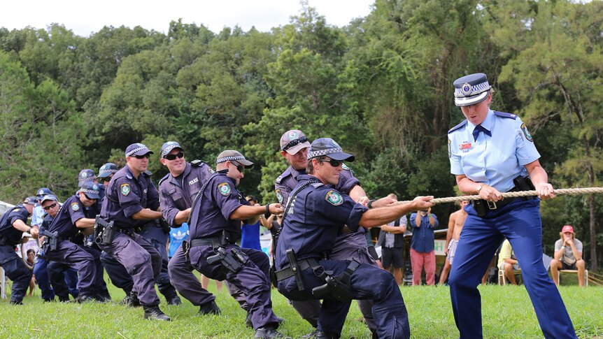 Police pull rope in tug of war