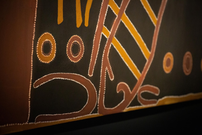 Close up detail of an Indigenous artwork. It features circles meant to symbolise mining pits.