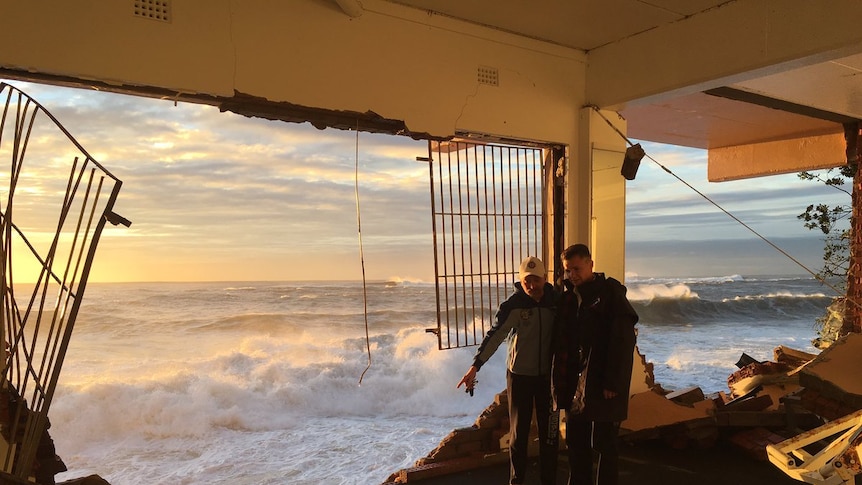 Local MP Matt Thistlethwaite inside the surf club where the wall has completely collapsed.