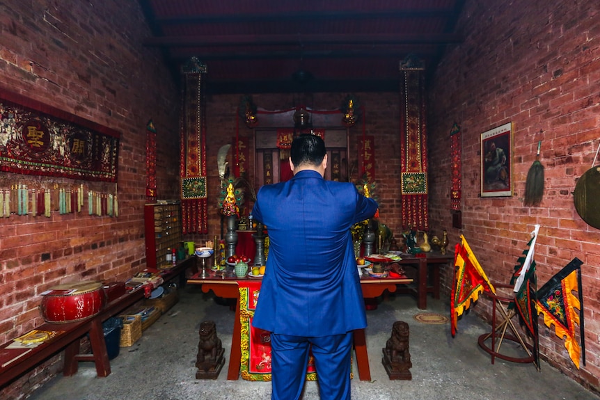 Bendigo surgeon Manny Cao at the main altar credits the temple with bringing him good fortune.