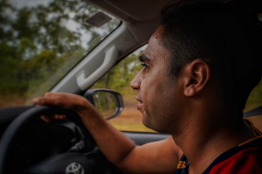 Michael looks out the windscreen as he drives.