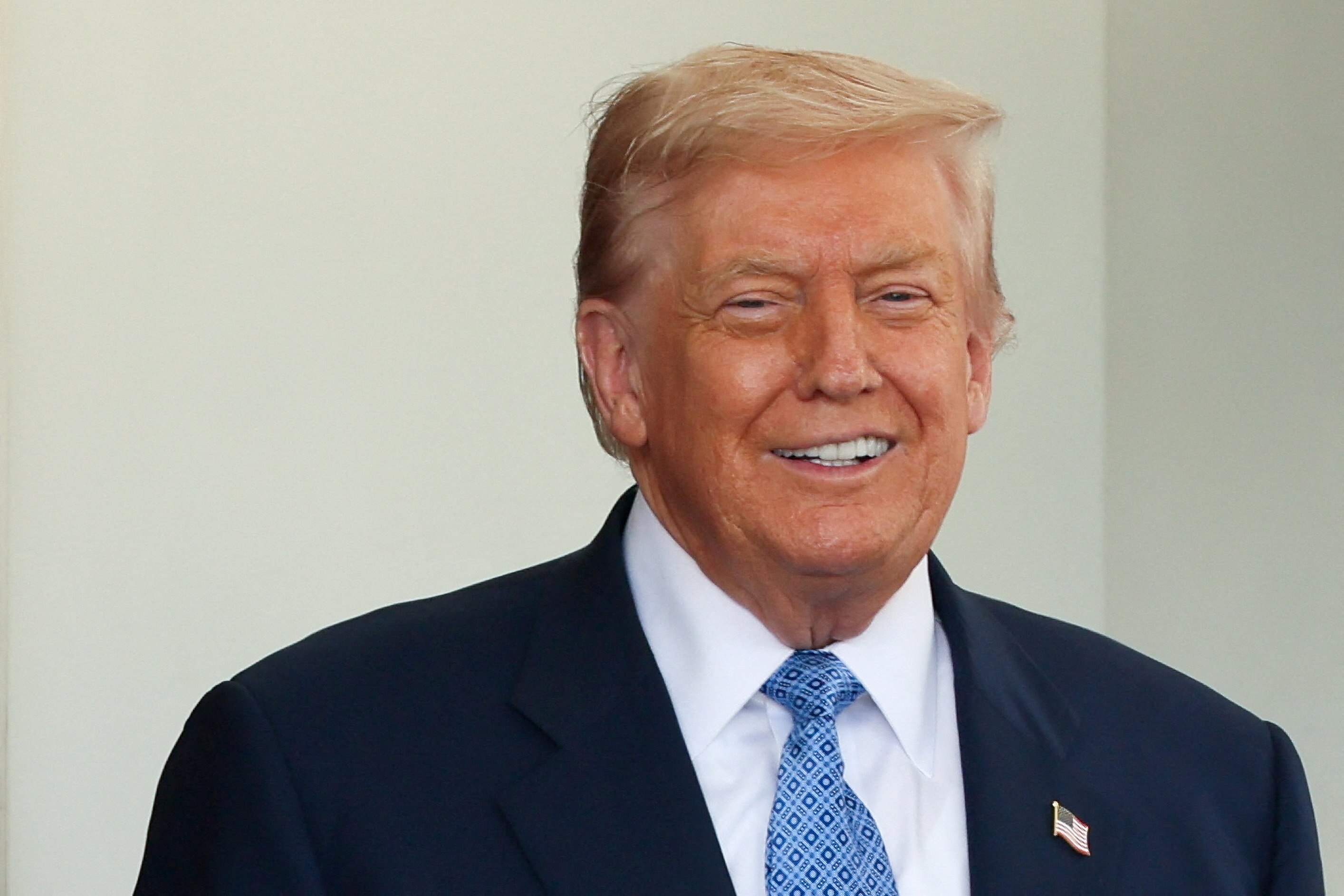 Donald Trump smiles.