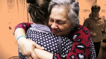 ABC presenter Jill Emberson hugging her daughter Malia, for a story about difficult medical conversations