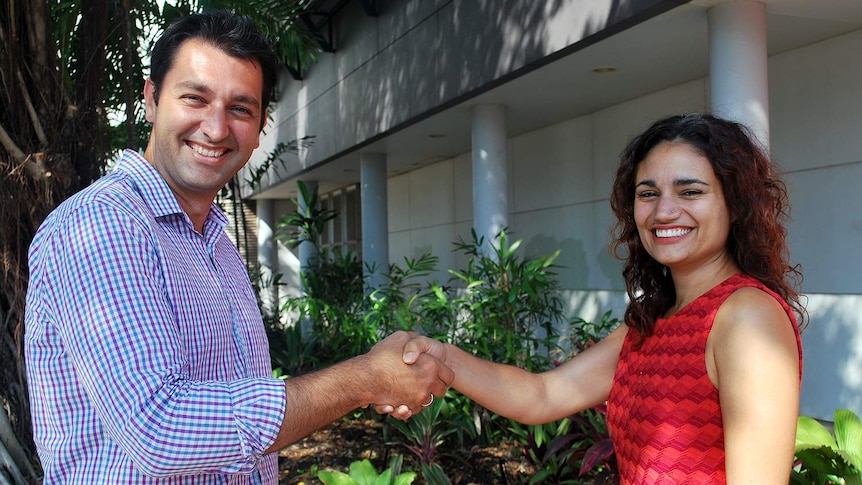 The Country Liberals Dr Harry Kypreos shakes hands with his Labor opponent Lauren Moss