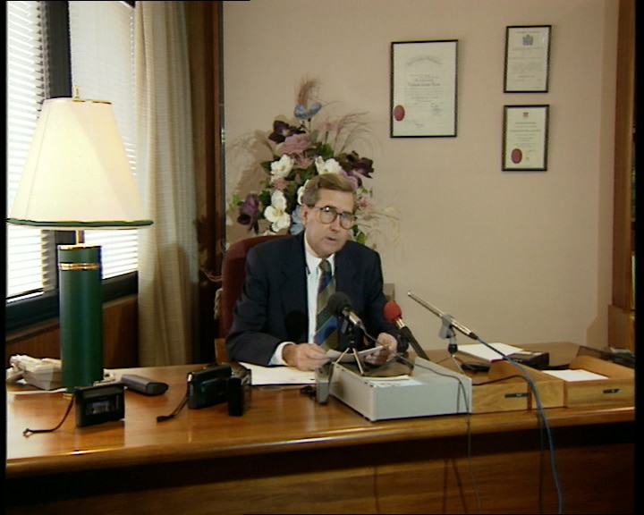 Michael Tate sits at his desk in Parliament House in Canberra in 1993.