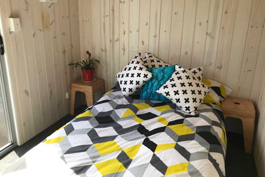The bedroom in the converted shipping container
