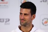 Novak Djokovic smiles during a press conference at the Dubai Tennis Championships