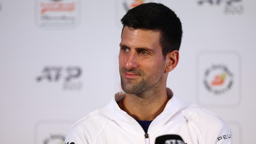 Novak Djokovic smiles during a press conference at the Dubai Tennis Championships