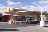 A petrol station with a Shell symbol on it