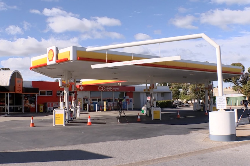 A petrol station with a Shell symbol on it