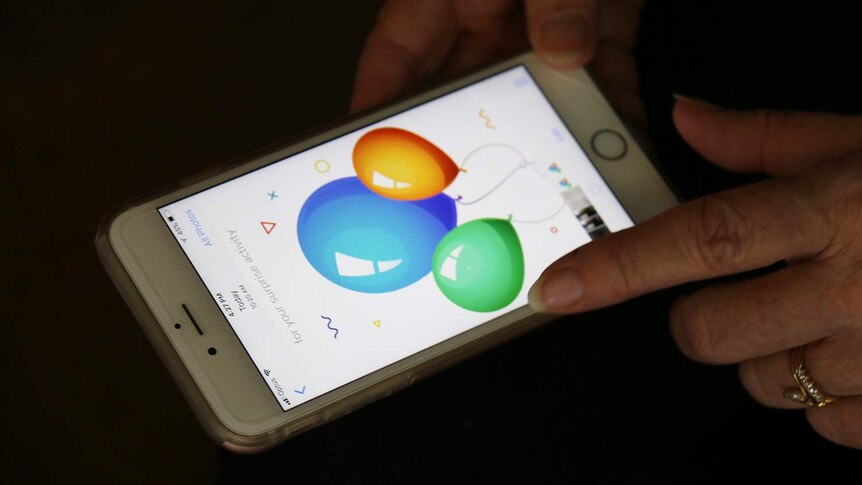 Close-up of a mobile phone showing the balloon activities on the Wantu App