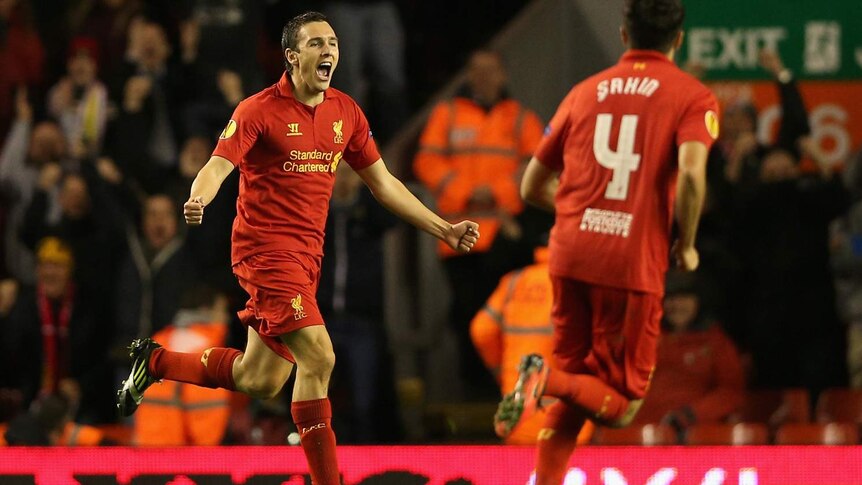 Stewart Downing celebrates after scoring the winner for the Reds.