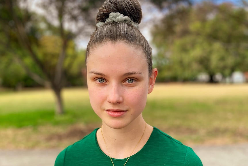 Adelaide sitting in a park in Melbourne.