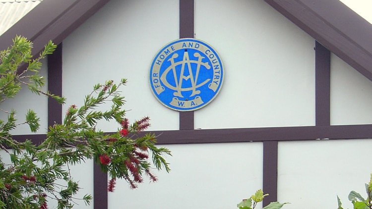 Front facade of CWA house with badge on the gable