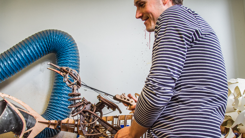 Nicholas Paine practises moving one of the bird puppets.